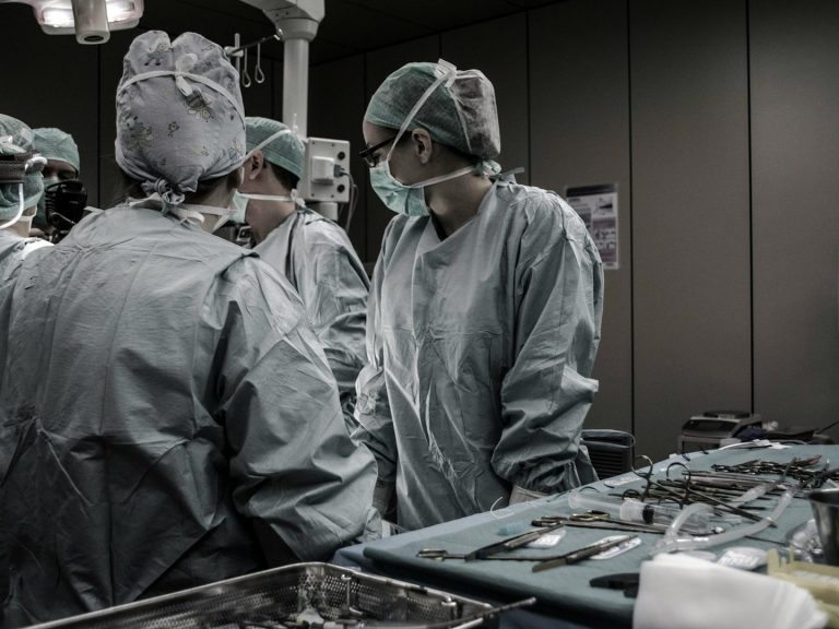 Medical Review and Legal Analysis of Vista Community Clinic Cases Medical professionals in discussion, representing patient reviews and legal evaluations of Vista Community Clinic’s healthcare practices.